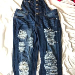 Ripped overalls with sequins under the rips